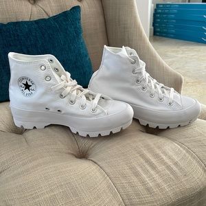 Brand new.  Never been worn platform converse.